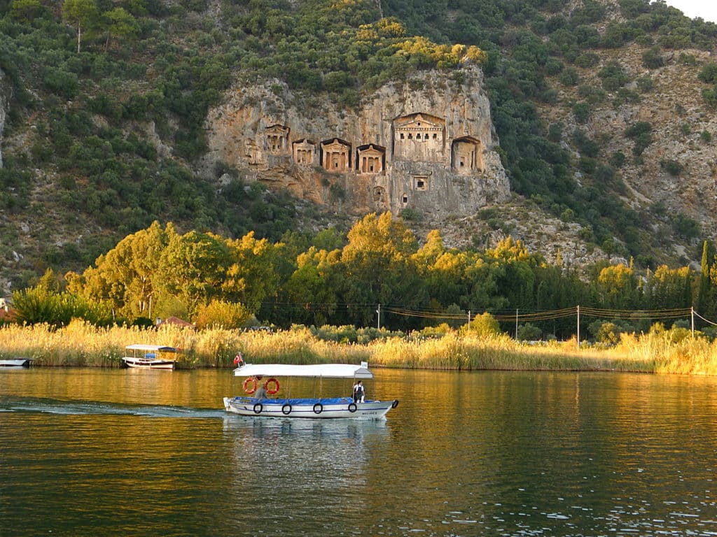 Dalyan river boat King Rock Tombs in the background